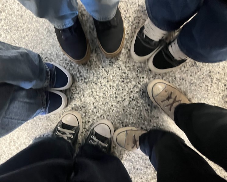 Students in Journalism class show off their Vans and Converse.